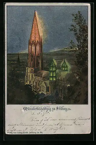 AK Freiburg i. Br., Beleuchtetes Münster mit Panorama