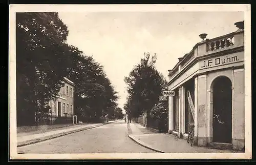 AK Varel i. O., Partie in der Oldenburger Strasse, mit Haus J. F. Duhn