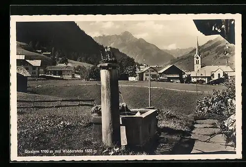 AK Riezlern, Ortspartie mit Brunnen und Widderstein