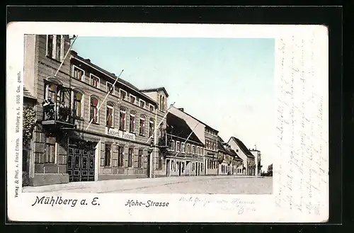 AK Mühlberg a. E., Partie in der Hohe-Strasse mit Kaiserlichem Postamt, mit leuchtenden Fenstern