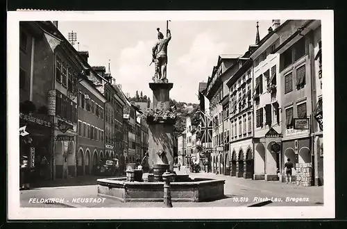 AK Feldkirch-Neustadt, Strassenpartie mit Brunnen