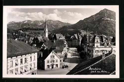 AK Dornbirn, Strassenpartie mit Restaurant, Geschäft von Xaver Hess u. Kirche