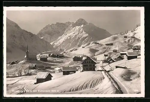 AK Hirschegg, Panorama mit Kirche und Widderstein im Schnee
