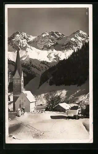 AK Mittelberg, Ortsansicht mit Schafalpköpf im Winter