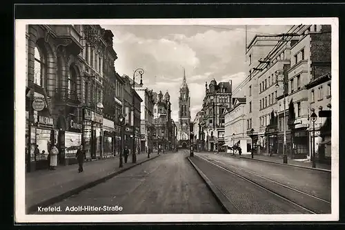 AK Krefeld, Strasse mit Geschäften