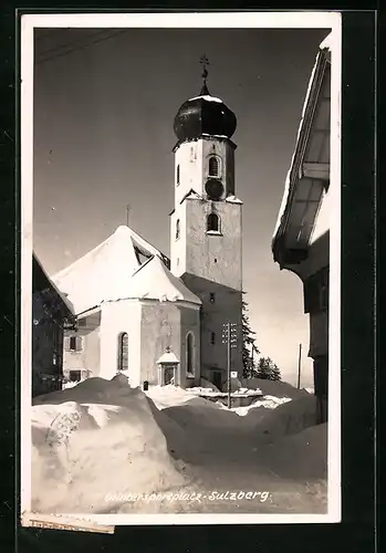 AK Sulzberg, Ortspartie mit Kirche im Schnee