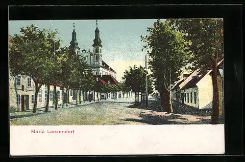 AK Maria Lanzendorf, Strassenpartie mit Kirche