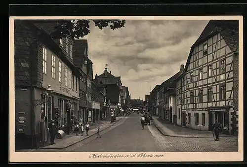 AK Holzminden a. d. Oberweser, Strassenpartie mit Geschäft