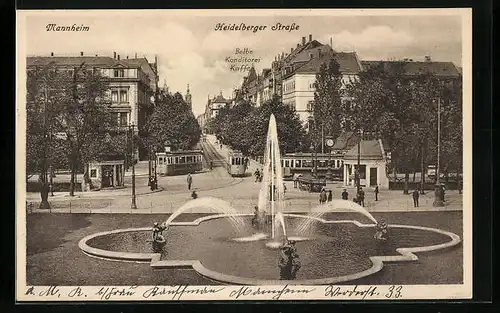 AK Mannheim, Heidelberger Strasse mit Strassenbahnen und Belbe Konditorei