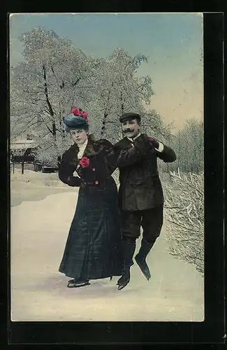 AK Paar auf Schlittschuhen im Schnee