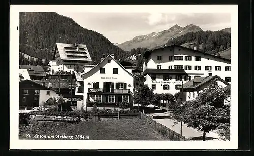 AK St. Anton, Ortsansicht mit Gasthof Schwarzer Adler