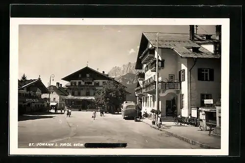 AK St. Johann, Strassenpartie mit Hotel Huber und Gasthof