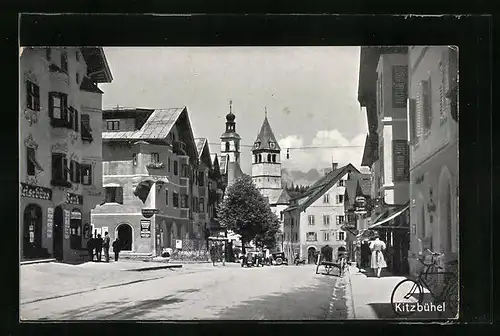 AK Kitzbühel, Strassenpartie mit Blick auf die Kirche