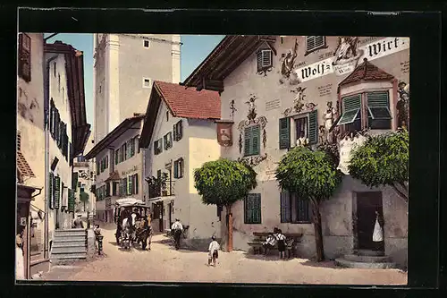 AK Kastelruth, Strassenpartie mit Gasthaus zum Wolfswirt