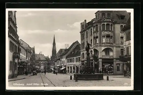 AK Offenburg, Partie in der Strasse mit Blick auf Kirche