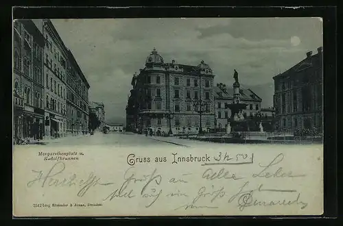 Mondschein-AK Innsbruck, Strassenpartie mit Gebäudeansicht und Denkmal