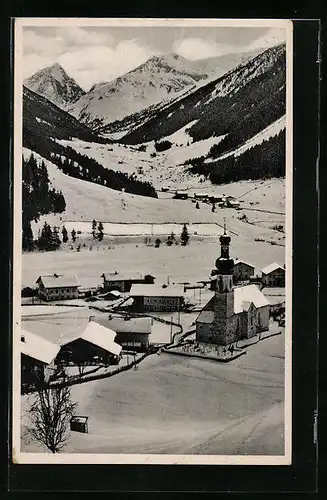 AK Gries i. Sellraintal, Ortspartie mit Kirche im Schnee