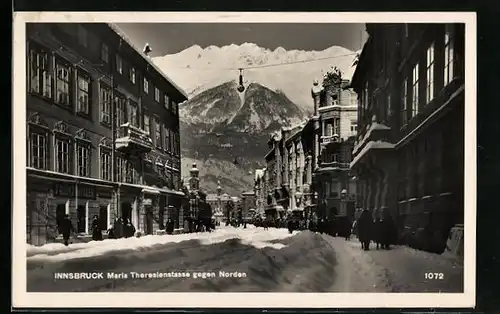 AK Innsbruck, Maria Theresienstrasse mit Geschäften gegen Norden im Schnee