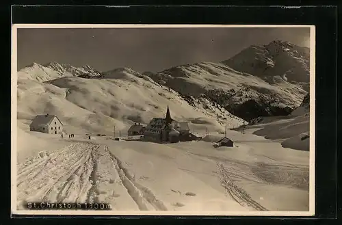 AK St. Christoph, Ortspartie mit Kirche im Winter