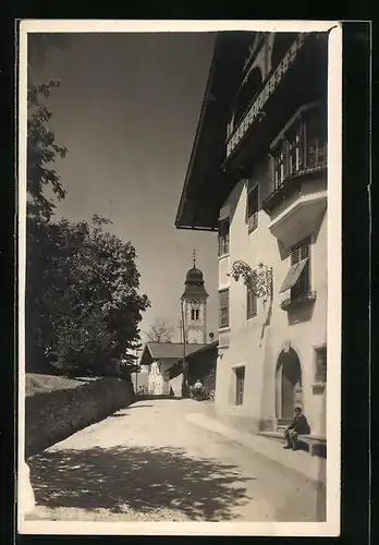 AK Lans bei Innsbruck, Strassenpartie mit Blick auf Kirche