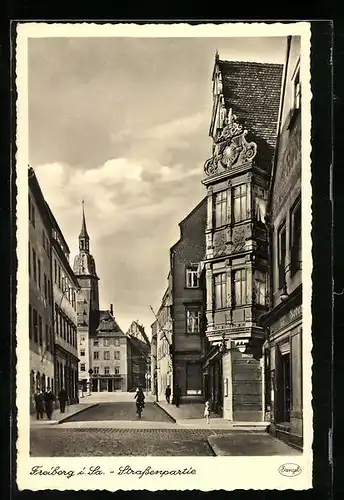 AK Freiberg i. Sa., Strassenpartie mit Geschäft