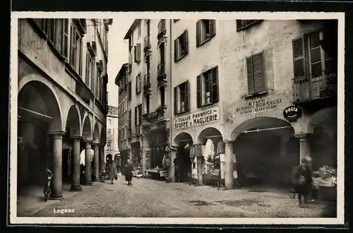 AK Lugano, Strassenpartie mit Geschäften, Stoffe e Maglierie