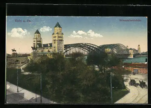 AK Köln a. Rh., Strassenpartie mit Hohenzollernbrücke im Hintergrund