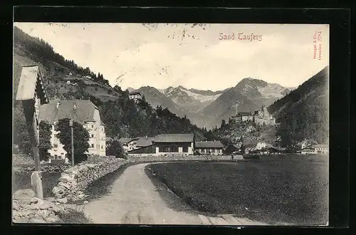 AK Sand in Taufers, Teilansicht mit Burg im Hintergrund