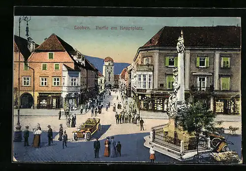 AK Leoben, Partie am Hauptplatz mit Geschäften und Denkmal