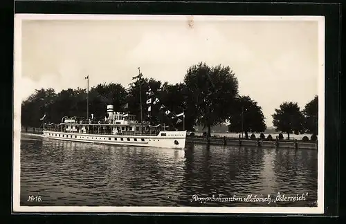 AK Doppelschrauben Motorschiff Österreich mit Flaggengala in See stechend