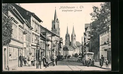 AK Mühlhausen i. Th., Wanfrieder-Strasse mit Geschäften und Kirche