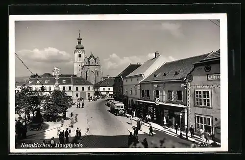 AK Neunkirchen, Hauptplatz mit Geschäften und Kirche, Strassenbahn