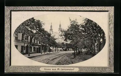 Präge-AK M. Lanzendorf, Strassenpartie mit Gasthaus u. Fleischhauerei und Kirche, Passepartout