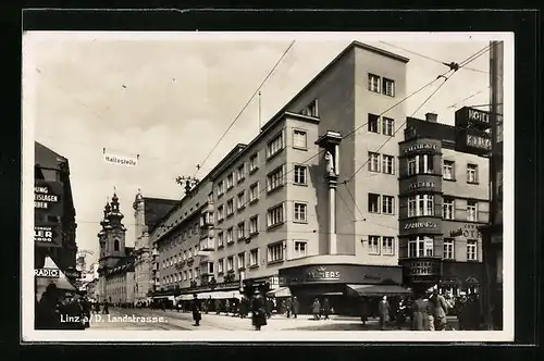 AK Linz a. D., Landstrasse mit Geschäften, Palmers