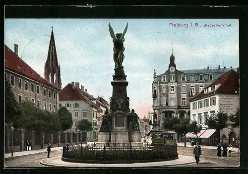 AK Freiburg i. B., Siegesdenkmal mit Strassenbahn