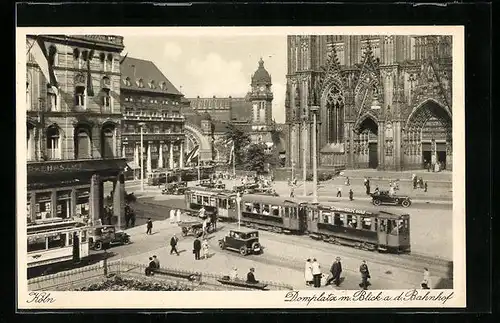 AK Köln am Rhein, Strassenbahnen auf dem Domplatz mit Blick auf den Bahnhof