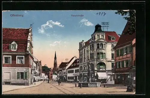 AK Offenburg, Partie in der Hauptstrasse mit Einhorn-Apotheke, Denkmal und Kirche