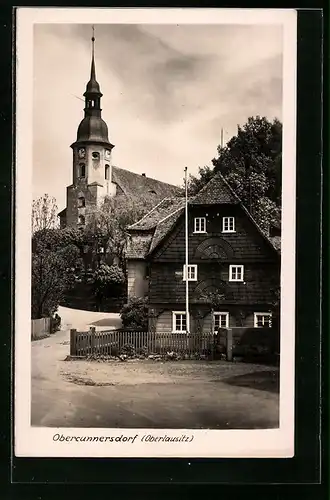 AK Obercunnersdorf /Oberlausitz, Strassenpartie bei der Kirche