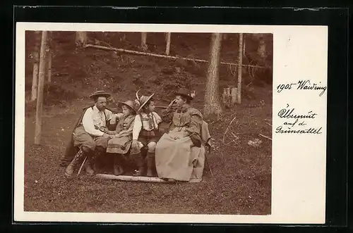 AK Waidring, Familie in Tracht auf einer Waldbank sitzend