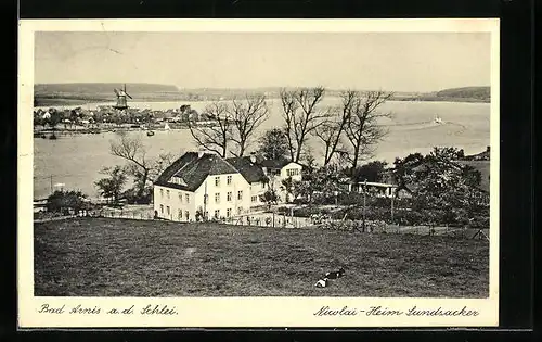 AK Bad Arnis a. d. Schlei, Nicolai-Heim Sundsacker mit Blick auf Wasser und Windmühle