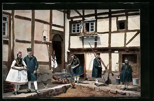 AK Hessen bei der Hofarbeit in Trachten