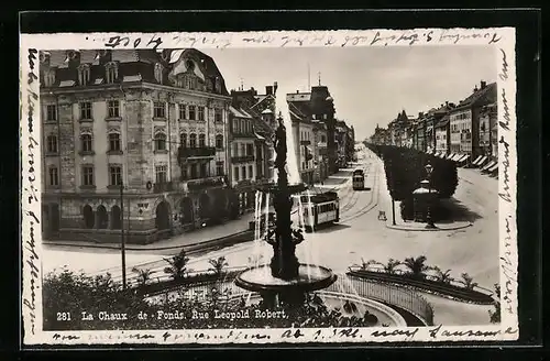 AK La Chaux de Fond, Rue Leopold Robert, Strassenbahn