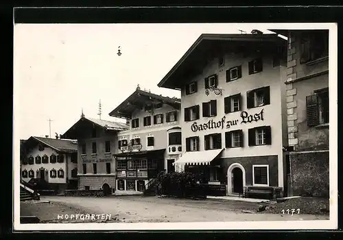 AK Hopfgarten, Strassenpartie mit Gasthof zur Post