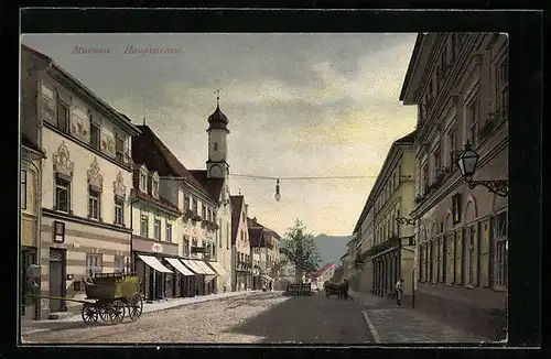 AK Murnau, Hauptstrasse mit Geschäften und Kirche