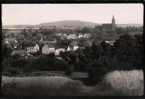 Fotografie Brück & Sohn Meissen, Ansicht Dahlen i. Sa., Blick über die Dächer der Stadt zur Kirche