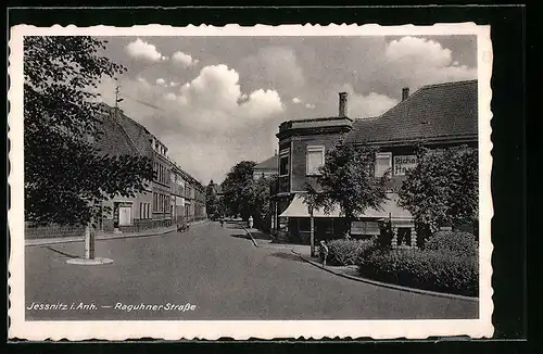 AK Jessnitz i. Anh., Raguhner Strasse mit Geschäften