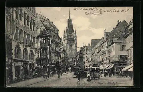 AK Freiburg i. B., Strassenpartie mit Strassenbahnverkehr