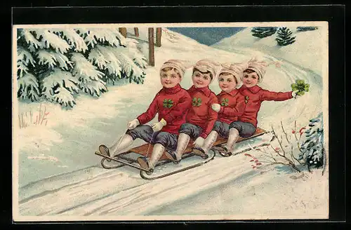 AK Jungen mit Kleeblättern auf einem Schlitten
