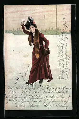 AK Dame auf Schlittschuhen mit einem Schneeball