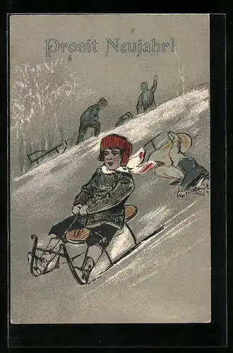 AK Kind fährt Schlitten den Hang hinunter